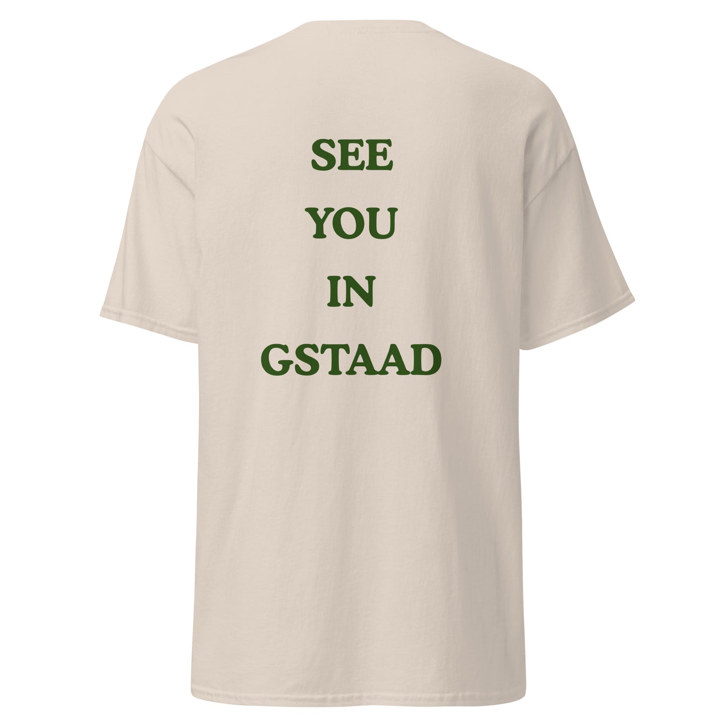 Green graphic text reading See You in Gstaad on the back of a natural colored unisex t-shirt