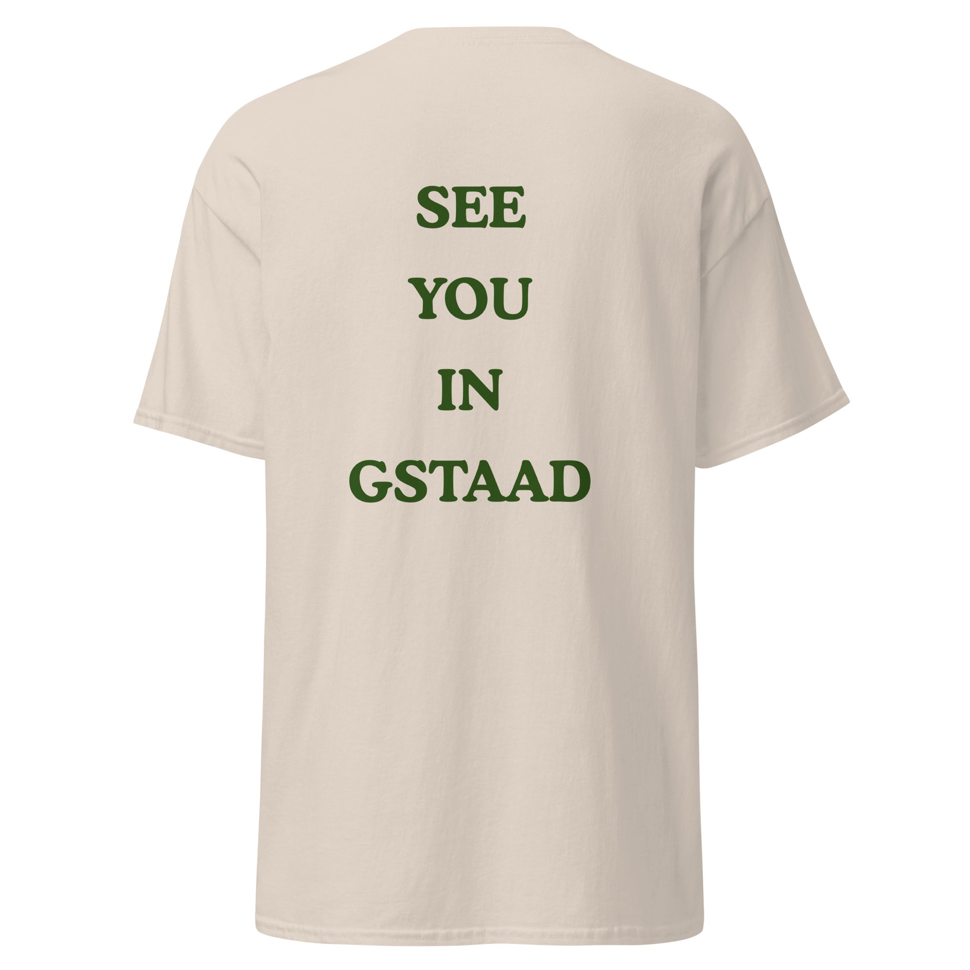 Green graphic text reading See You in Gstaad on the back of a natural colored unisex t-shirt