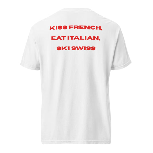 Red graphic text reading Kiss French, Eat Italian, Ski Swiss on the back of a white heavyweight t-shirt