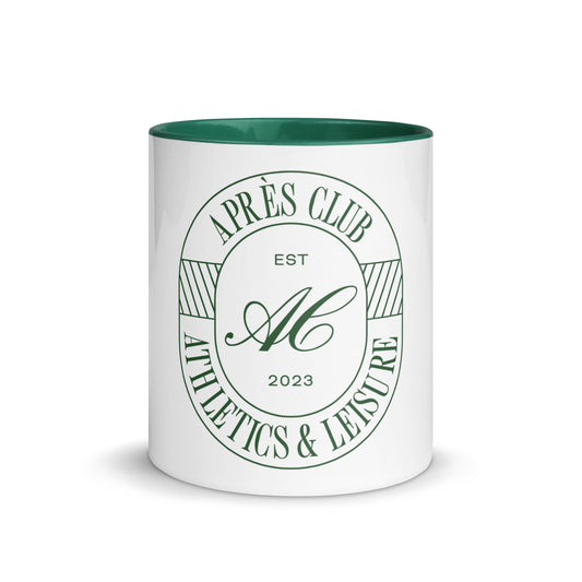 White ceramic Clubhouse Mug with dark green interior and Après Club badge