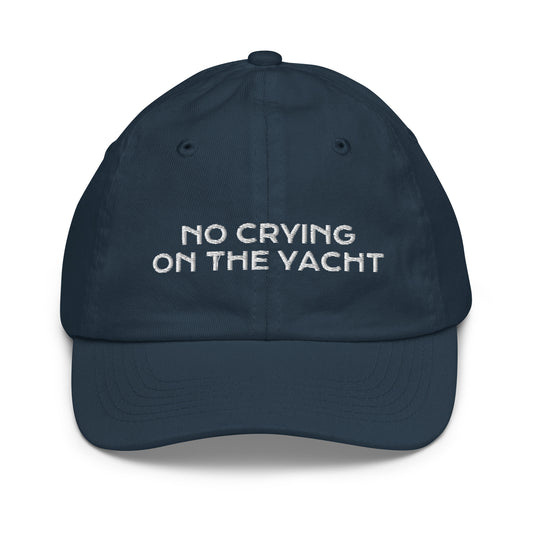 Navy kids baseball cap embroidered with No Crying On The Yacht in white
